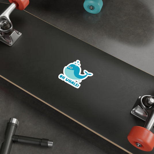 Oh Whale Sticker on Black Skateboard Deck