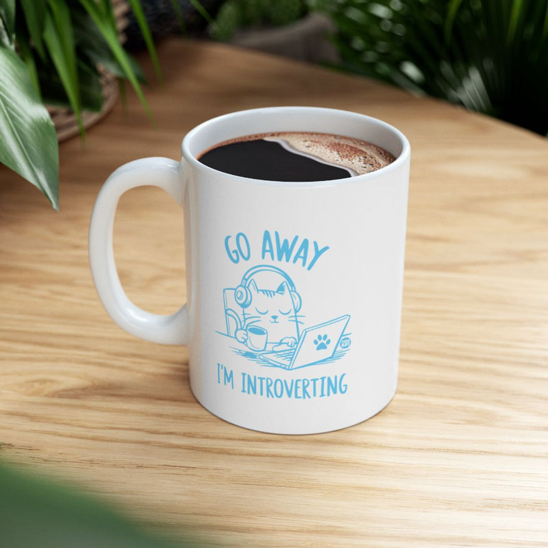 Load image into Gallery viewer, Go Away I'm Introverting Cat with Laptop Mug

