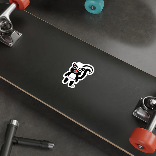 Cartoon Skunk Sticker on Black Skateboard Deck