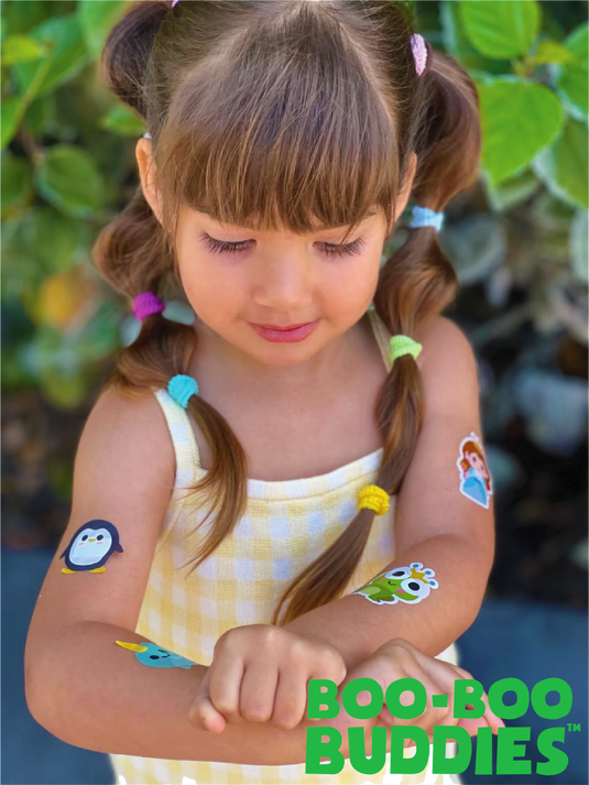 Child wearing multiple Boo Boo Buddies bandages