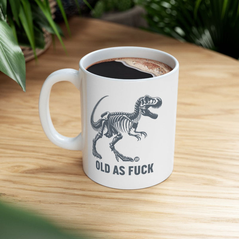 Load image into Gallery viewer, Old As Fuck Dinosaur Skeleton Coffee Mug
