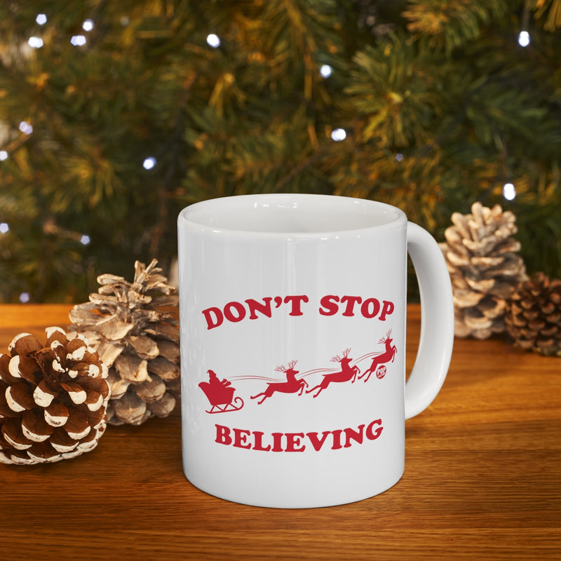 Load image into Gallery viewer, Don&#39;t Stop Believing Santa Mug
